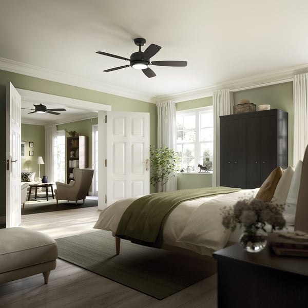 Modern bedroom with black ceiling fan, bed, ottoman, and window.