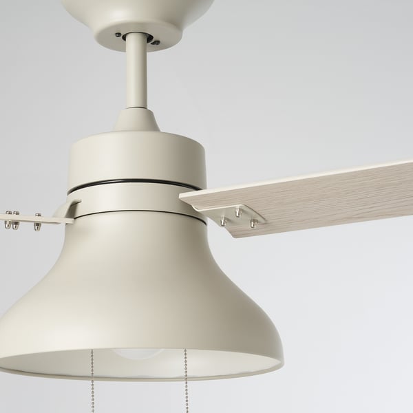 Modern ceiling fan with wooden blades and sleek metal body.