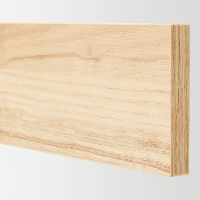 Light wooden surface with smooth, even grain pattern; two edges visible, showcasing craftsmanship and quality.