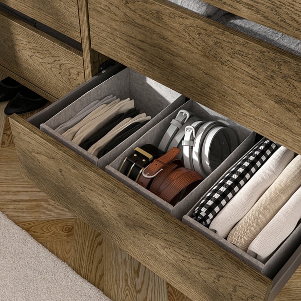 Open drawer with compartments for belts, ties, and socks, part of AURDAL storage system.