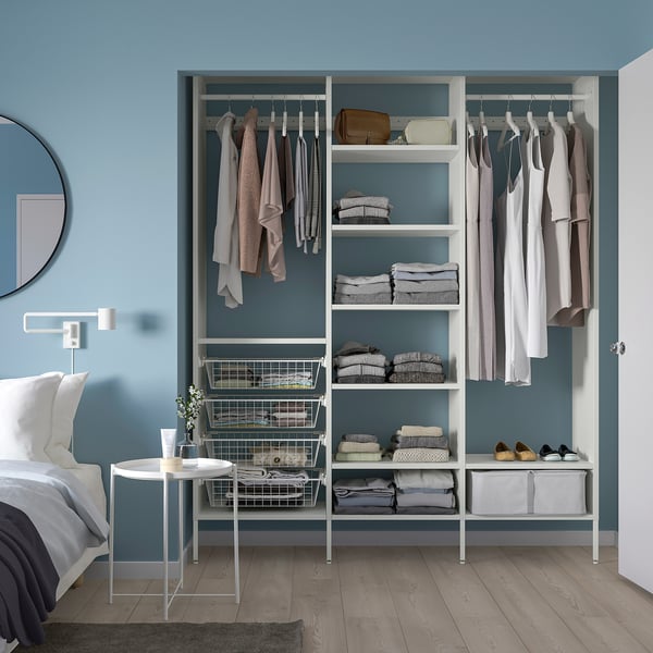 AURDAL storage in bedroom: shelves, hangers, baskets. Fits near bed, with mirror & table.
