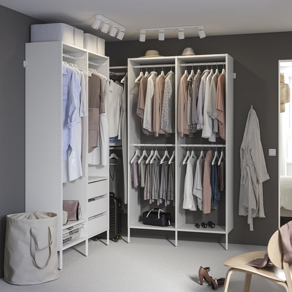 White AURDAL closet system with clothes, drawers, and shelves; modern, organised, and sleek design.