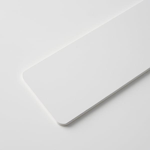 White rectangular slab on a white surface, smooth and seamless, reflecting light uniformly.