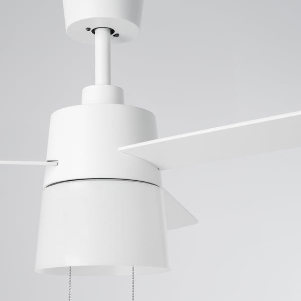 Modern white ceiling fan with 3 blades, central light, and pull chains, hanging neatly from the ceiling.
