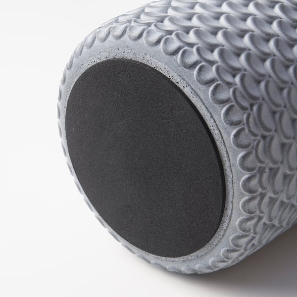Grey concrete planter with textured surface and felt bottom.