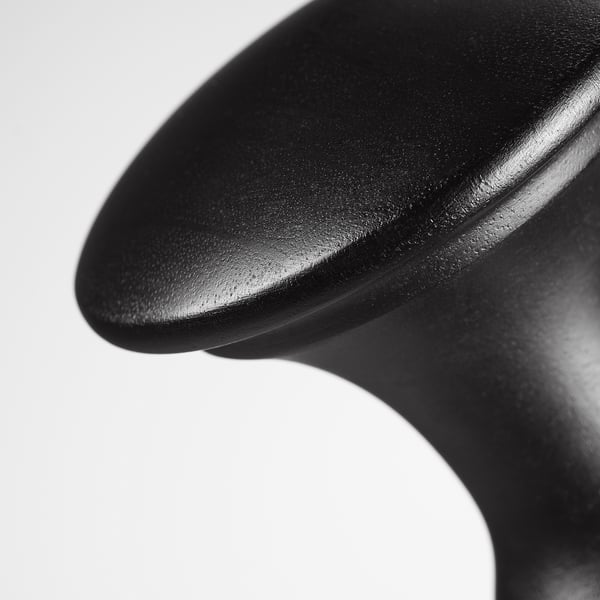 A close-up of a black finial, smooth and polished, showcasing its sleek design and matte finish.