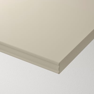 Shelf with bevelled and smooth edges, light colour. High-quality materials, minimalist design.