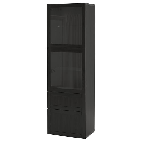A black IKEA BESTÅ storage unit. It glass doors and drawers for storage and display, with a sleek modern design.