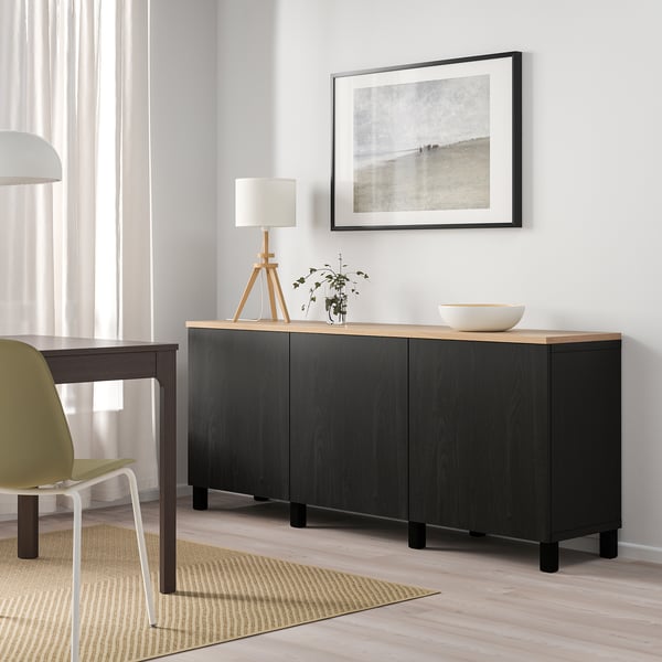 BESTÅ black sideboard with light top, adjustable shelves, and soft-close. Includes small table and lime chair.