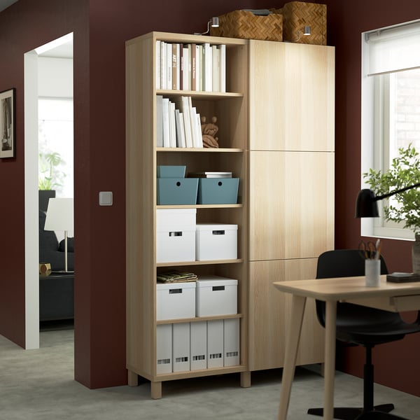 BESTÅ storage unit: light wood, open/closed shelves, organised.