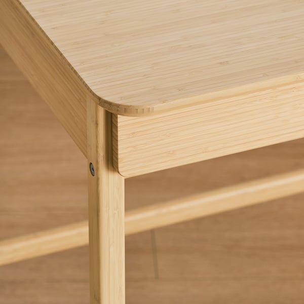 Modern bamboo desk with smooth, rounded edges and sleek design, showcasing its durable and elegant finish.