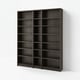 Dark wooden BILLY bookcase with multiple empty shelves against a plain wall.