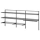 A BOAXEL black wall-mounted storage system with metal shelves and a drying rack, designed for organising laundry.