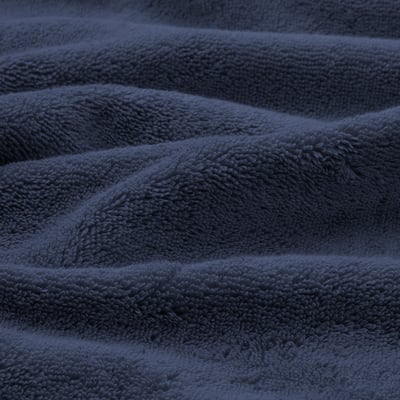 Thick, plush organic cotton towels in deep blue. Soft, intricate weave, elegant border detail. Highly absorbent, luxurious feel.
