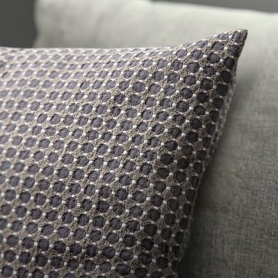 Decorative cushion cover with intricate dobby-weave pattern, soft cotton feel.