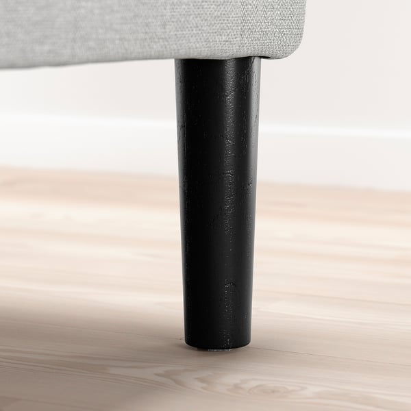 Image depicts a chair leg, cylindrical, made of dark wood, supporting upholstered seat, suitable for modern and classic designs.
