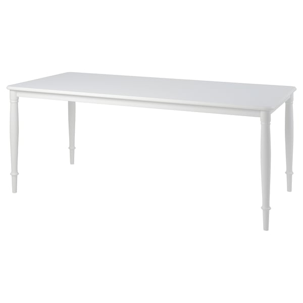 White DANDERYD dining table, rectangular, with sturdy steel legs.