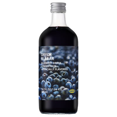 Blueberry drink bottle by IKEA. Dark purple liquid in clear glass, labelled with blueberries and swedish text. Silver cap.