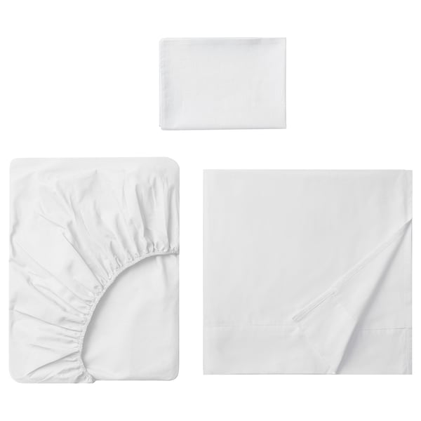 Displays a white DVALA bed linen set, consisting of a flat sheet, a fitted sheet, and a pillowcase, all made of 100% natural cotton.
