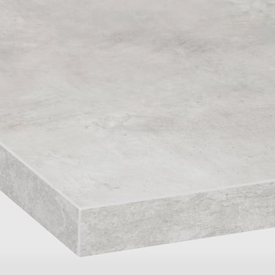 Smooth, light-colored laminate countertop, showcasing a sleek, modern design with gently rounded edges and a polished finish.