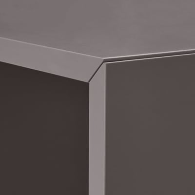 Minimalist storage cube with sleek, grey finish and clean, bevelled edges.