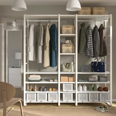 Modern closet with open shelves and hanging space, neatly organising clothes and accessories.