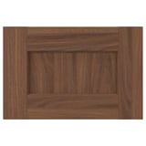 Wooden cabinet door in brown walnut with subtle grain pattern. Square shape and minimalist design.