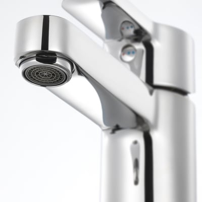 Modern, chrome-plated tap with sleek design, featuring a black lever and dual temperature controls, emphasising quality and durability.