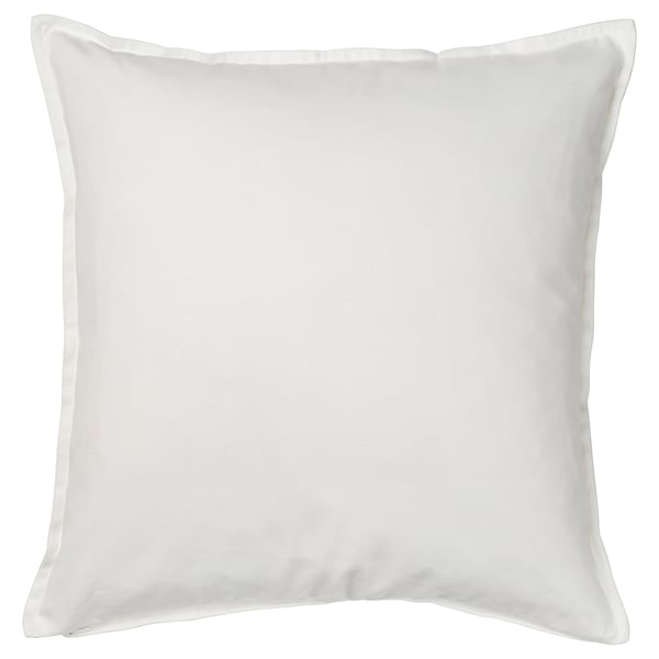 A white, square FACELIOR cushion cover with intricate embroidered floral designs, made of 100% cotton.