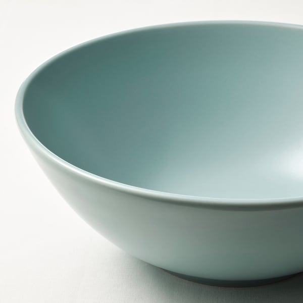 Large matte glazed bowl in muted green, smooth and stylish design.