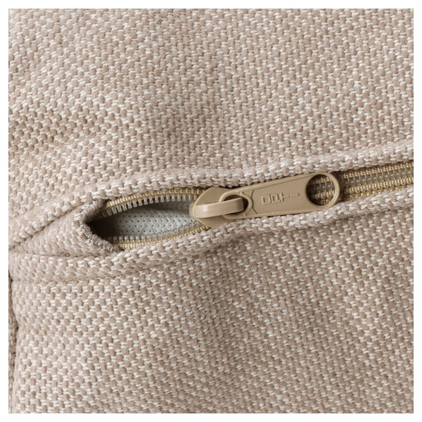 Close-up of high-quality zip on FINNALA sofa sectional, showcasing beige woven fabric and durable gold zip pull.