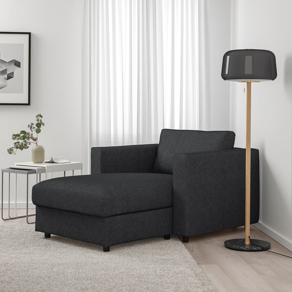 FINNALA grey modular sofa with chaise in living room. Modern, removable cover, large lamp, minimalist decor.