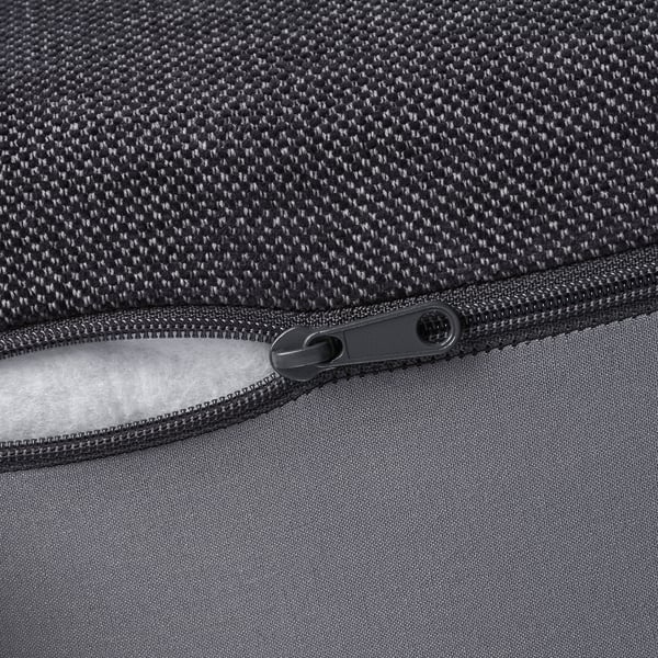 Close-up of bag zip, partially open, showing lining and exterior texture.