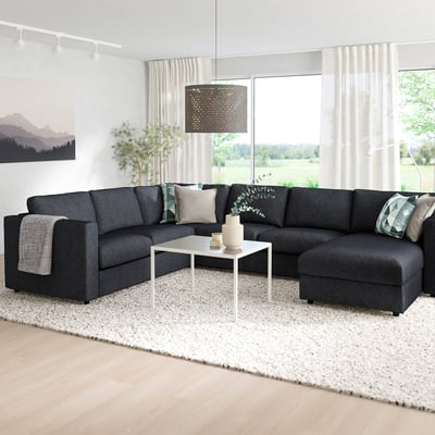 Grey FINNALA sectional sofa in modern living room with natural light.