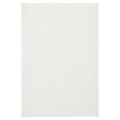 White FINTSEN recycled polyester bath mat with latex backing.