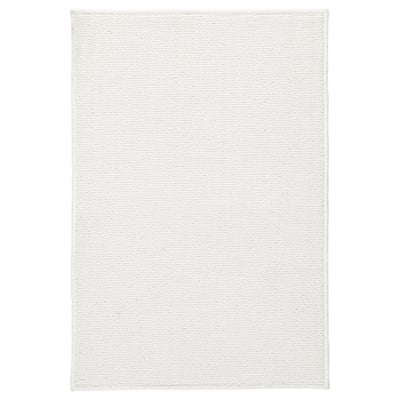 White FINTSEN recycled polyester bath mat with latex backing.