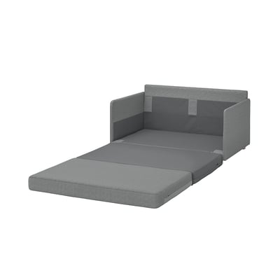 A grey FRIDHULT sofa bed. Its compact, modern, with a minimalist design. The back is finished and it has wooden legs.