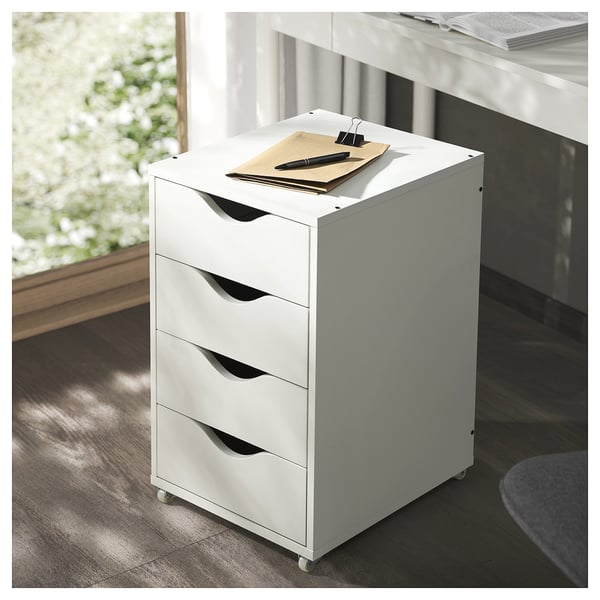 White FRIIDROTT four-drawer rolling unit, sleek and modern with a minimal design, suitable for home or office.
