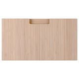 A rectangular wooden drawer front in natural bamboo colour with integrated handles.