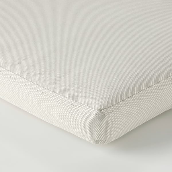 Light-colored, smooth cushion cover with neat stitching, likely made from eco-friendly recycled materials, displayed flat.