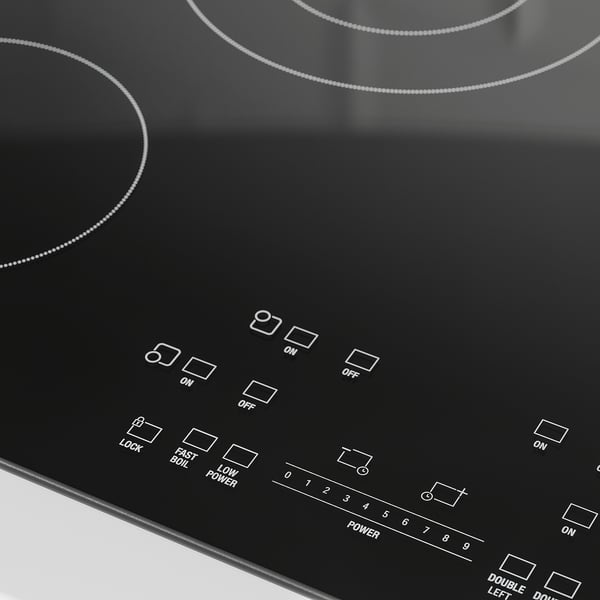 Black electric cooktop with glass surface, touch controls, and power display.