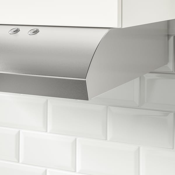 Stainless steel kitchen hood mounted in cabinet with led light, sleek design.