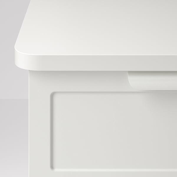 Minimalist white bedside table with flip-open door and open shelf, wall-mounted for easy cleaning.