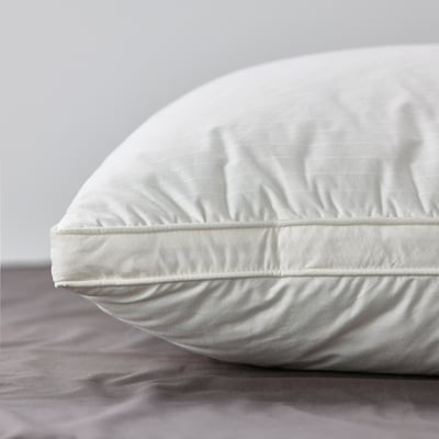 Close-up of luxury pillow with supportive core and soft, dobby woven cotton cover.