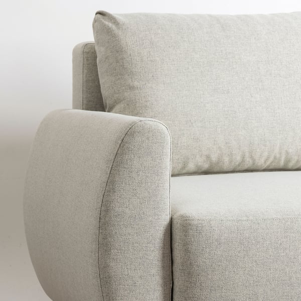 Modern grey sofa with clean lines. Soft, upholstered cushions; sturdy armrests and back, promising comfort and durability.