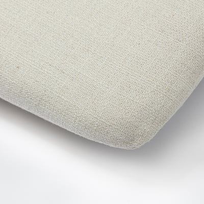 Soft, beige cushion with woven texture, likely for added comfort to seating.