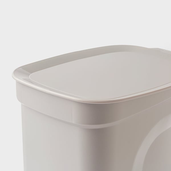 White plastic bin with rounded edges, textured grip, and overhang for kitchen waste.