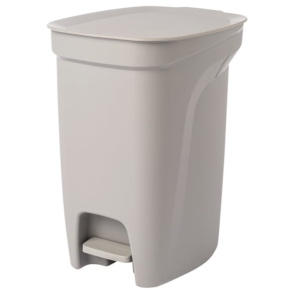 A HÄCKSAX pedal bin in beige with a handle, made of plastic, for kitchen use.