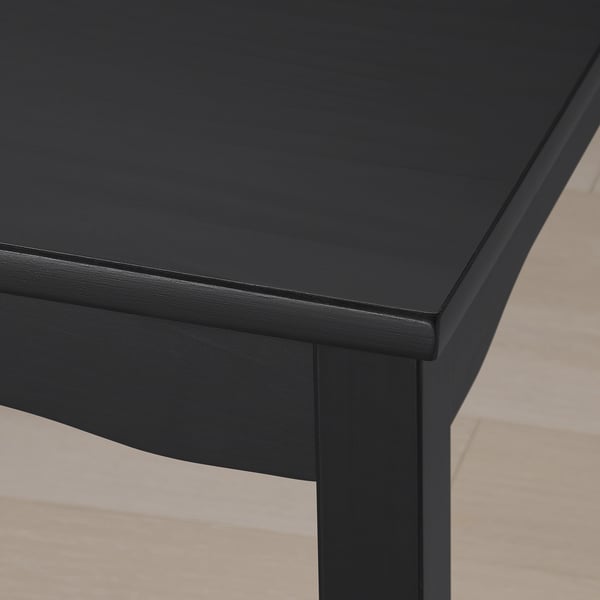 Black bar table made of high-quality pine, smoothly finished with multiple coats of clear lacquer, showcasing its robust and modern design.