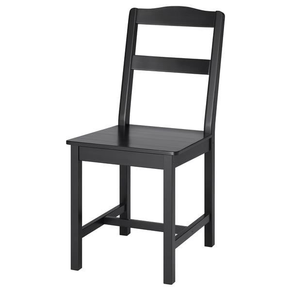 A HÄGERNÄS black wooden chair with a classic design, made from solid pine, and featuring a backrest with vertical slats.